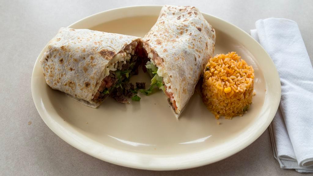 Burrito De Carne Asada / Beef Steak Burrito · Con frijoles, queso, lechuga, tomate y arroz. / Served with beans, cheese, lettuce, tomato and a side of rice.