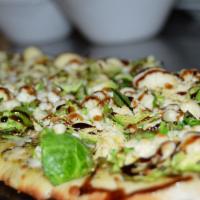 Brussels Sprout Flatbread · Brussels sprouts, bacon, feta cheese drizzled with balsamic vinegar.