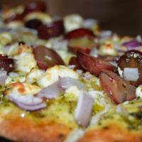 Bleu Cheese Flatbread · Pesto, blue cheese, roasted grapes, red onion drizzled with honey.