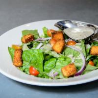 Caesar Salad · Romaine lettuce, parmesan cheese, crispy croutons, cherry tomatoes, red onion, and Caesar dr...