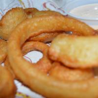 Mom'S Onion Rings · Large sweet onion rings battered and fried until golden brown. Served with spicy ranch.