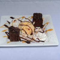 Drunk'N Brownie · Warm house made brownie with ice cream, whipped cream, chocolate and caramel sauce.