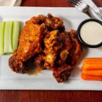 (5)Traditional Bone-In Wings · Your choice of crispy breaded fried or grilled chicken wings. Tossed in your favorite signat...