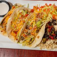 Steak Tacos · Grilled, seasoned skirt tacos with a ginger soy glaze, garnished with lettuce, pico de gallo...