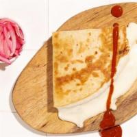 Quesadilla · Grilled corn tortilla filled with Oaxaca cheese.