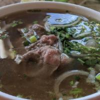 Pho Tai · Rice noodle soup with medium rare eye round beef.