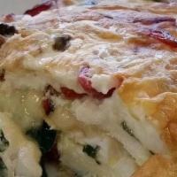 Egg White Delight Omelette · Talk about guilt-free indulgence! Feast on fresh spinach, mushrooms, roasted red peppers and...
