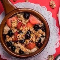 Berry Berry Oatmeal · Blueberries and strawberries topped with granola and honey