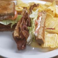 L.T. · Bacon, lettuce & tomato served on  bread with chips.