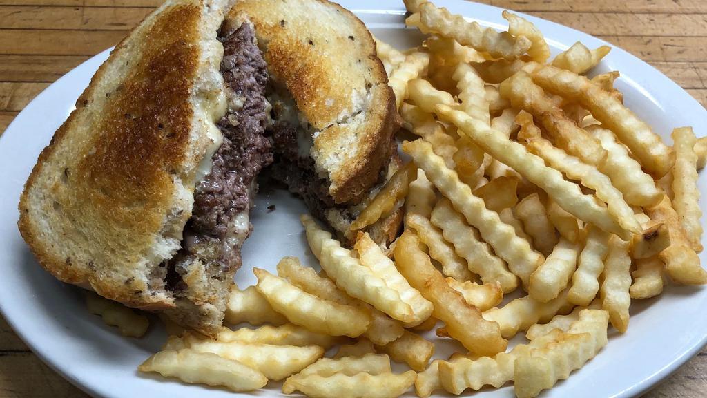 Patty Melt · Juicy 1/2 lb burger served on rye bread with melted Swiss cheese and grilled onions with chips.