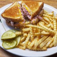 Grilled Ham & Cheese · Grilled ham and melted American cheese with chips.