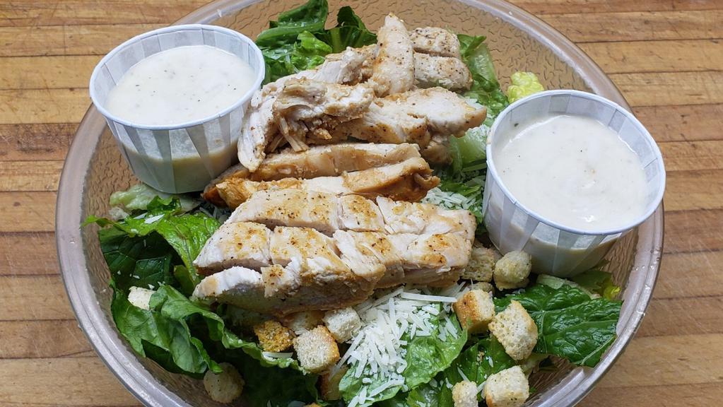 Chicken Caesar Salad · Chicken served over fresh romaine lettuce, parmesan cheese and croutons.