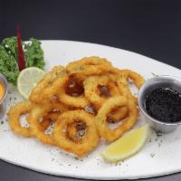 Calamari Rings · Deep fried breaded squid with home made yum-yum sauce and Japanese sauce.
