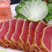Tuna Tataki · Lightly seared blue fin tuna with Cajun seasoning.