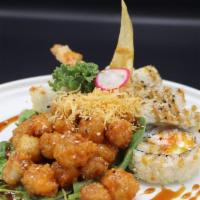 Scallop Crunch Roll · Crab, shrimp tempura, cream cheese, and avocado with deep fried scallop.