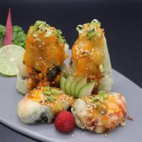 Mountain Roll · Spicy tuna, crab, cream cheese deep fried with green onion on top.