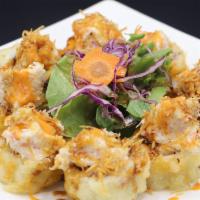 Snow White Roll · Deep fried crab roll with snow crab on top.