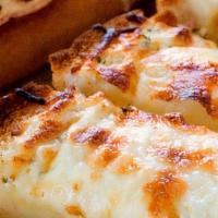 1/2 Dozen Cheese Bread  · Cheese Bread covered with mozzarella cheese and a side of sauce.