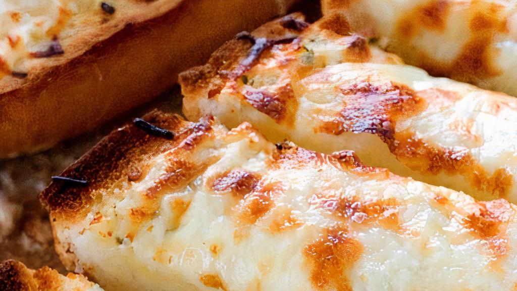 1/2 Dozen Cheese Bread  · Cheese Bread covered with mozzarella cheese and a side of sauce.