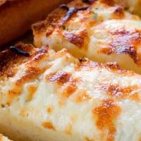 Dozen Cheese Bread · Cheese Bread covered with mozzarella cheese and a side of sauce.