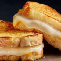 The Classic · Melted cheese inside bread butter toasted on the griddle.
