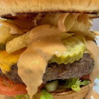 The Crunch · 8 oz. Angus beef burger, VL Tavern Shoppe Sauce, lettuce, garlic pickles, potato chips, Amer...