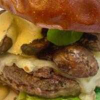 The Forager · 8 oz. Angus beef burger, roasted cremini mushrooms, swiss cheese, dijonnaise. Served on a pr...