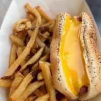 Cheese Dog · Vienna beef hot dog topped with Cheddar cheese sauce on poppy seed bun and served with fries.