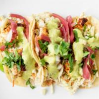 Fish Tacos · Three corn tortillas filled with eight ounce  of grilled cod, homemade jalapeño-lime slaw, h...