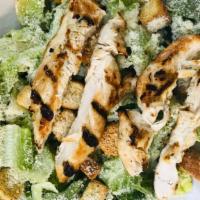 Chicken Caesar Salad · Chopped romaine lettuce tossed in homemade caesar dressing, topped with parmesan cheese, hom...