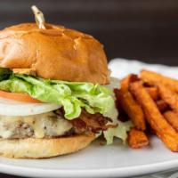 Turkey Burger · Homemade ground turkey and wild rice patty topped with melted Havarti, bacon, homemade cranb...