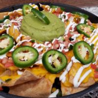 Nacho Platter · Tortilla chips topped with a blend of cheeses, pico de gallo, sour cream, guacamole, jalapeñ...