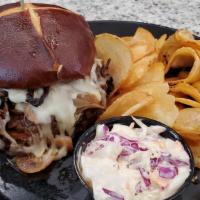 Beef'D Up Burger · Topped with pot roast, provolone, sautéed mushrooms, caramelized onions, garlic mayo on a pr...