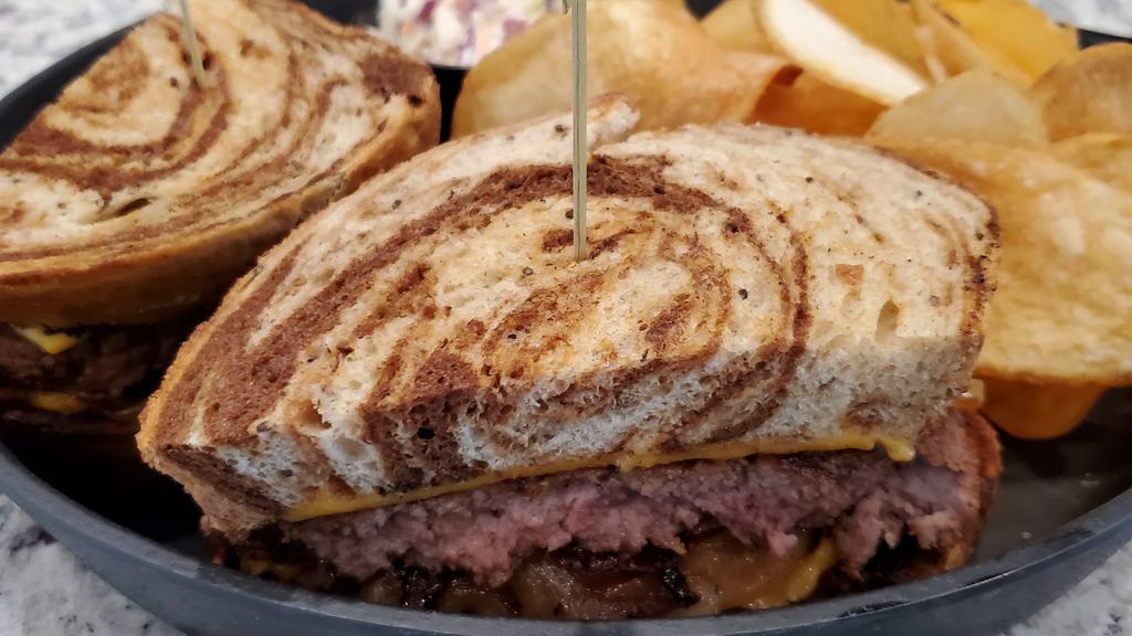 Patty Melt · American cheese, caramelized onions between thick grilled rye bread.