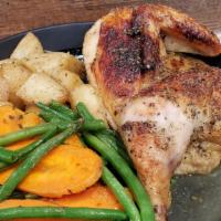 Oven-Roasted Chicken · Half chicken, seasonal vegetables, roasted potatoes, bread and butter.