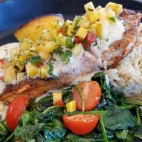 Blackened Salmon · Blackened salmon served over rice with spinach & cherry tomatoes, topped with mango salsa & ...