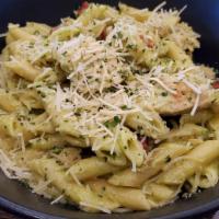 Chicken Pesto Pasta · Grilled sautéed chicken, cherry tomatoes, olive oil, tossed in pesto, topped with shredded p...