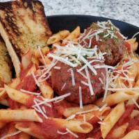 Meatball Dish · 2 oversized meatballs with marinara over penne pasta, topped with parmesan cheese, garlic br...