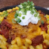 Chili Mac · Home made chili, cheddar cheese, sour cream, green onion.