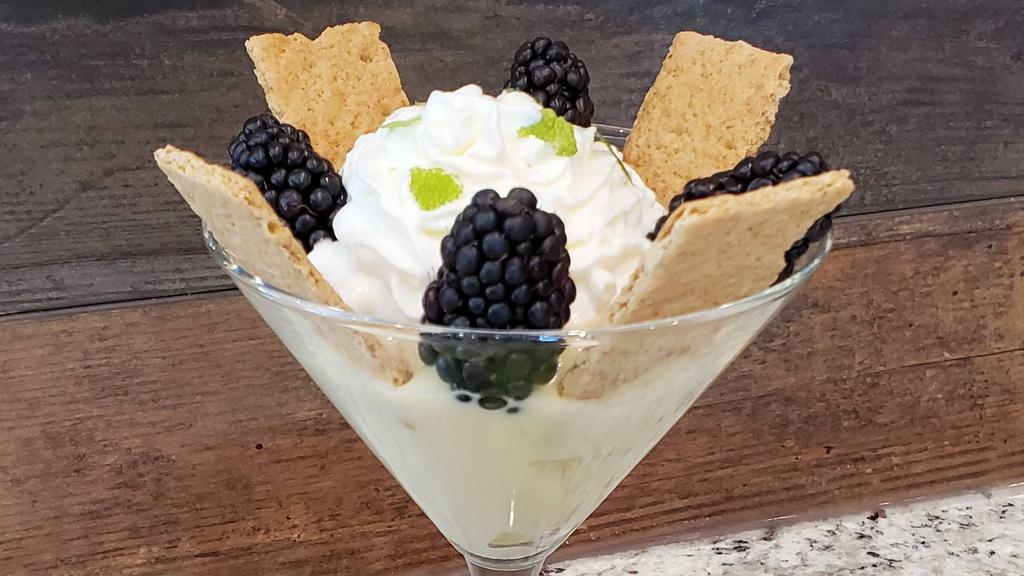 Key Lime Pie · Topped with fresh berries, and whipped cream.