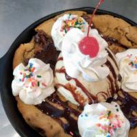 Chocolate Chip Cookie Sundae · Vanilla ice cream, chocolate sauce, whip cream, sprinkles on a giant chocolate chip cookie.
