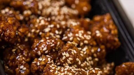 Sesame Chicken · Spicy. Stir-fried marinated boneless chicken and dried chili topped with sesame seeds.