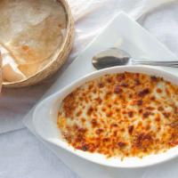 Queso Fundido Con Chorizo · Melted cheese with spicy pork sausage. Served with flour tortillas.