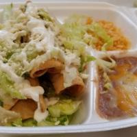 Flautas Dinner · Three crispy tacos filled with chicken and topped with lettuce, pico de gallo, sour cream an...