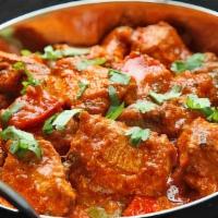 Chicken Karai · Boneless chicken thigh meat, Yak n yeti curry masala, dry chili, red-yellow dice onions, red...