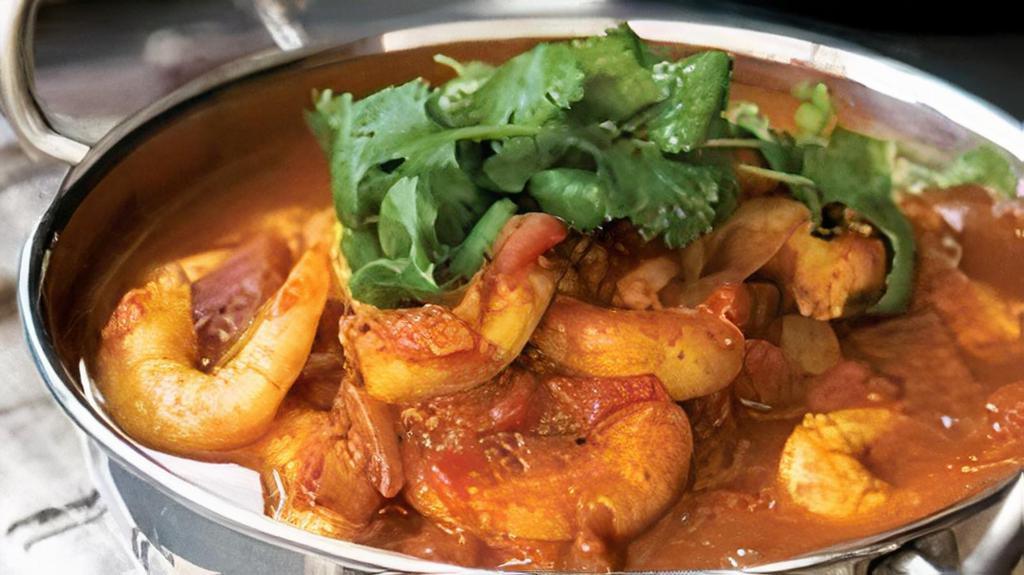 Shrimp Karai · Shrimp, Yak n yeti curry masala, dry chili, red-yellow dice onions, red-black bell pepper dice