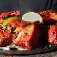 Chicken Tandoori · Marinated Chicken legs and thigh, Yak N Yeti Tandoori Masala, lemon juice, red-yellow onions...