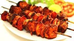 Chicken Tikka Kabab · Marinated chicken, Yak N Yeti Kabab Masala, lemon juice, red-yellow onions, food color, Cila...