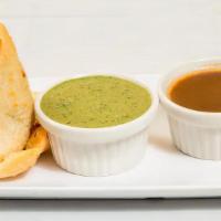 Veg Samosa (2) · Mixed veg curry cooked with potatoes wrapped in an all- purpose flour tortilla