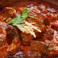 Goat Vindaloo · Goat meat with bones, Yak n yeti curry masala, dry chili, red-yellow dice onions, red-black ...